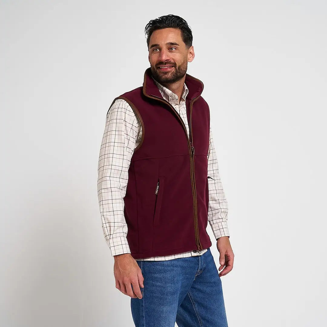 Maroon Jack Pyke Countryman Fleece Gilet with brown zipper trim and two lower zipped pockets in 300gsm micro fleece