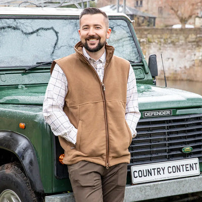 Green Land Rover Defender with Jack Pyke Countryman Fleece Gilet, 300gsm micro fleece style