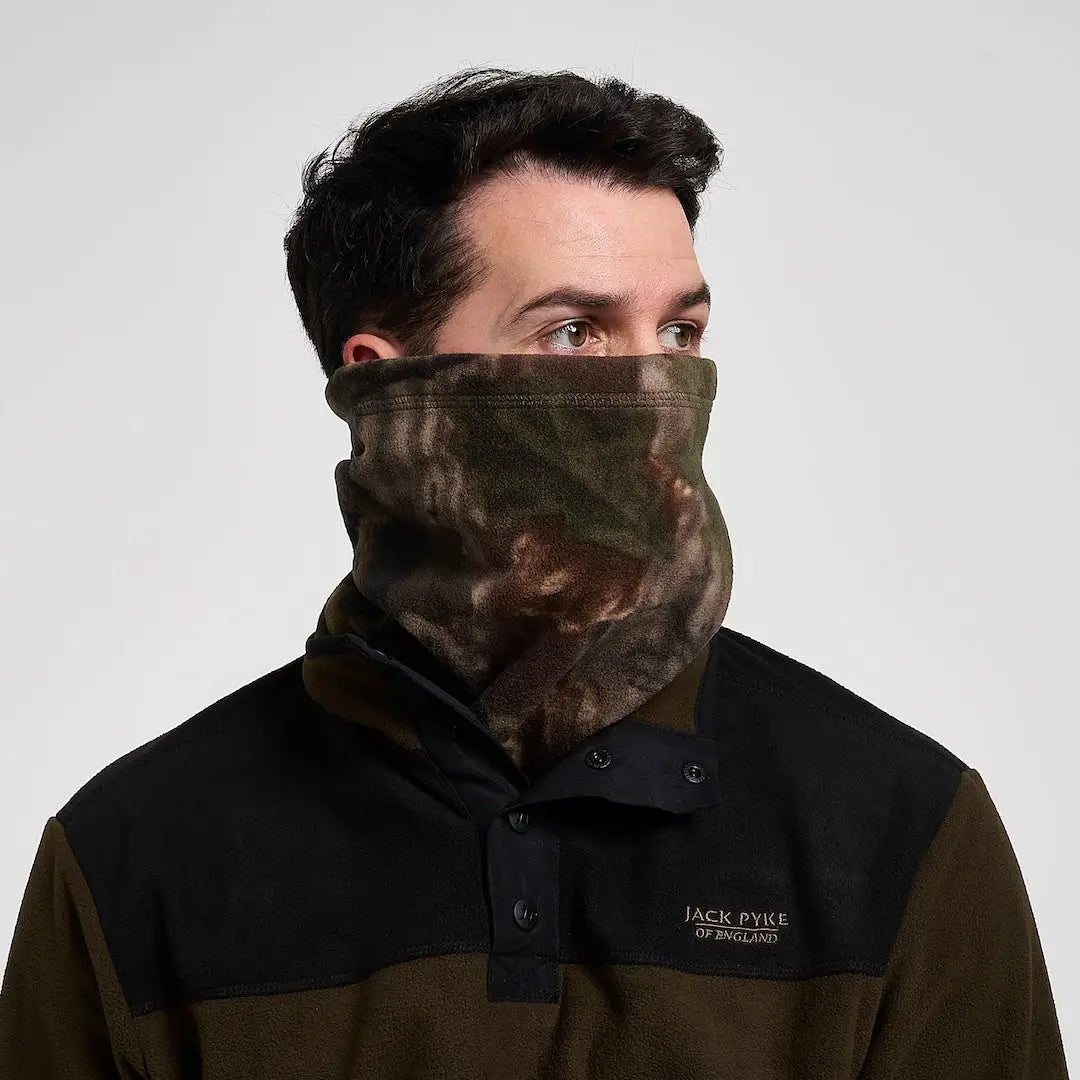 Man in Jack Pyke Fleece Neck Gaiter with camo pattern
