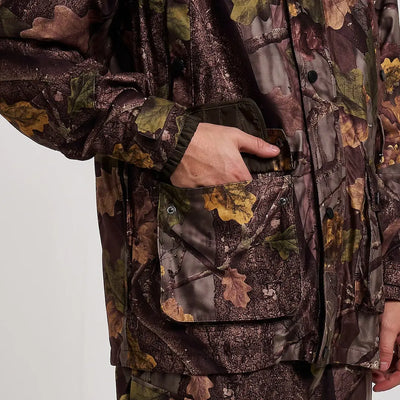 Hand reaching into Jack Pyke Hunter jacket pocket with camo leaf pattern