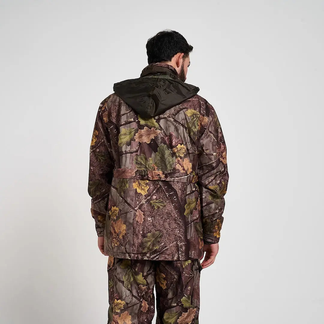 Man in Jack Pyke Hunter jacket with full camo suit and leaf patterns