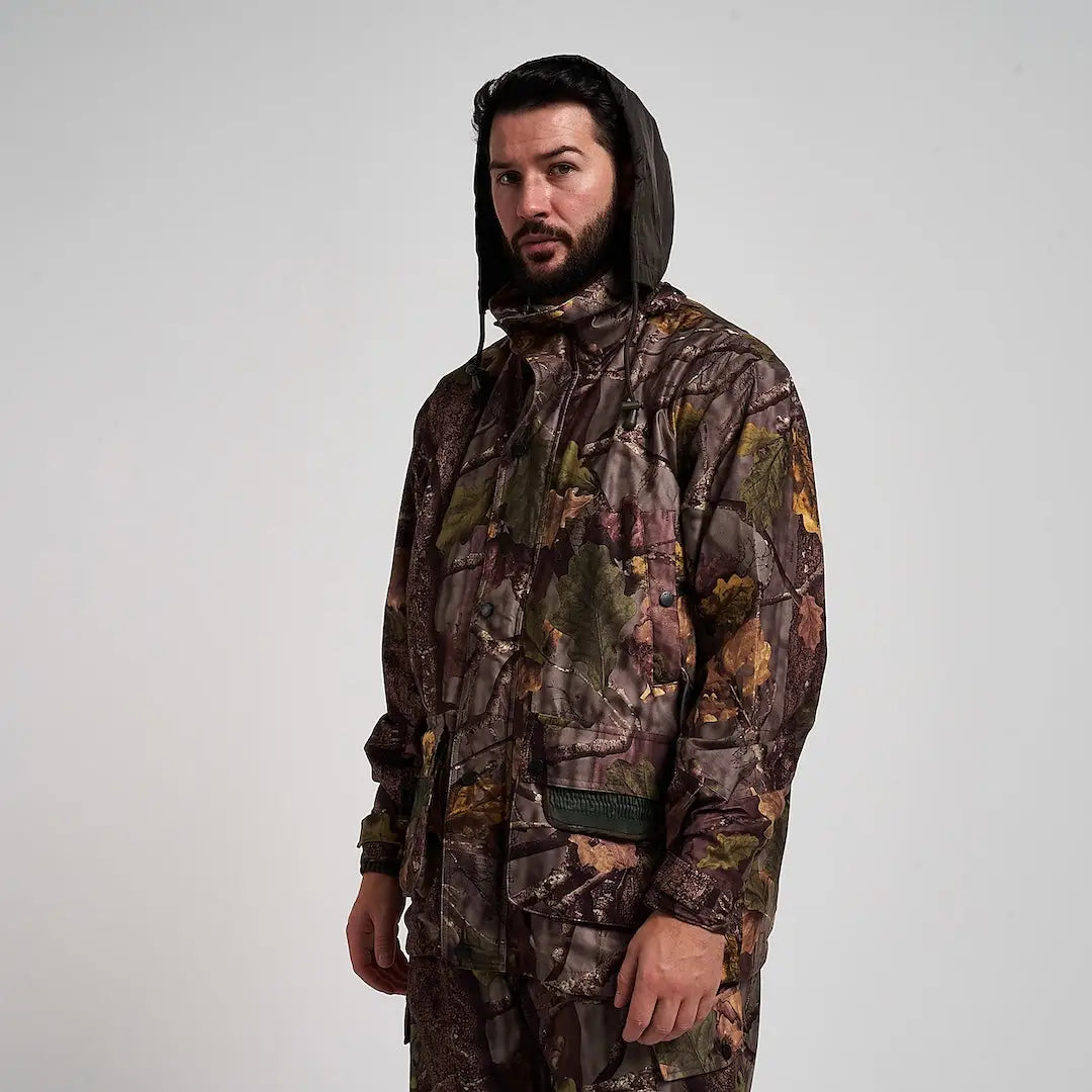 Man in Jack Pyke Hunter jacket with camo raincoat and adjustable cuffs