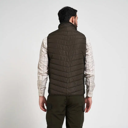 Jack Pyke Hybrid Quilted Gilet in dark olive over plaid shirt