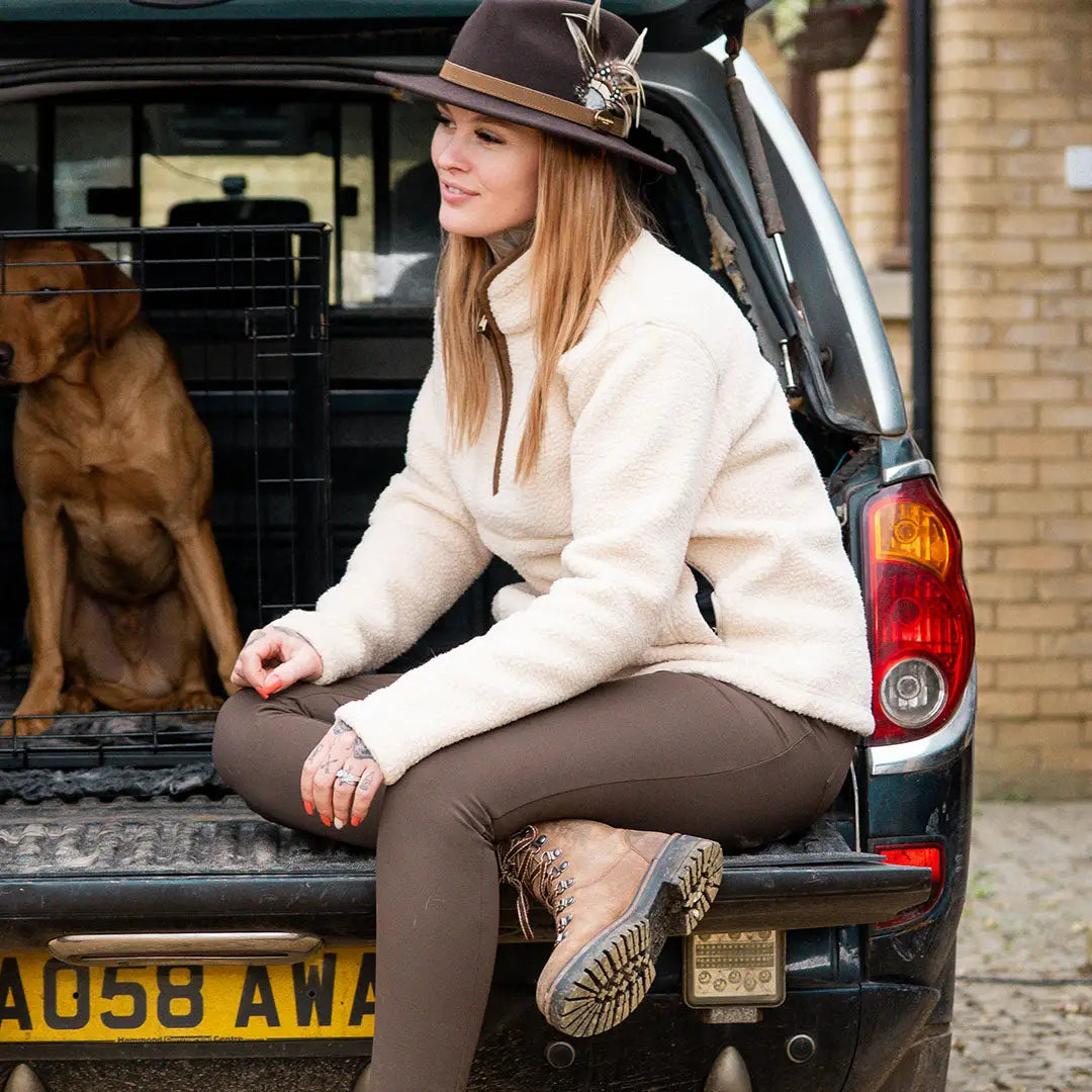 Jack Pyke sherpa fleece pullover with cream fleece, brown pants, boots