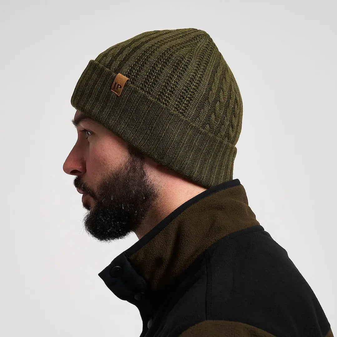 Olive green Jack Pyke merino wool beanie with leather patch, practical winter accessory