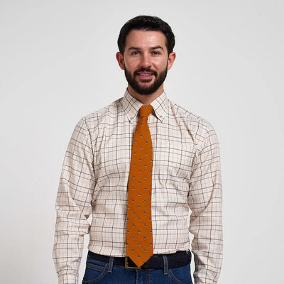Vibrant Jack Pyke Partridge silk tie in orange with subtle dark motifs
