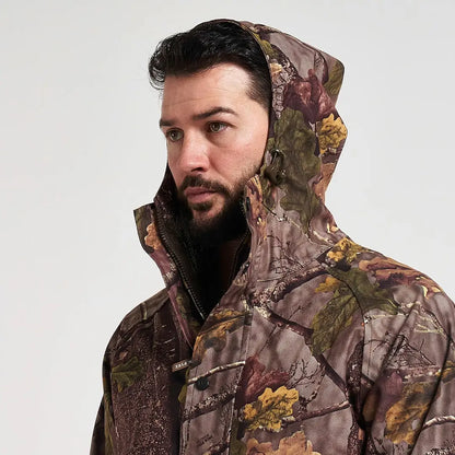 Man in Jack Pyke Rannock waterproof hunting jacket with camo pattern