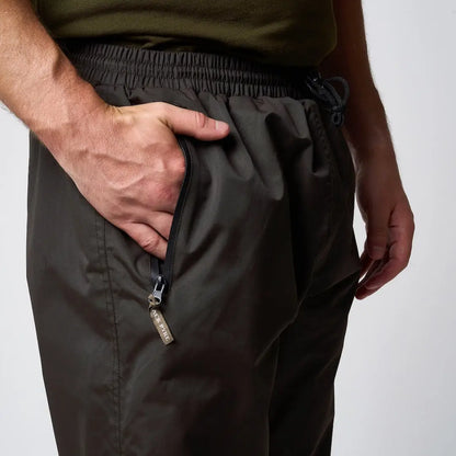 Jack Pyke Technical Featherlite Trousers: dark olive cargo pants with drawstring waist and zippered pockets in lightweight waterproof suit