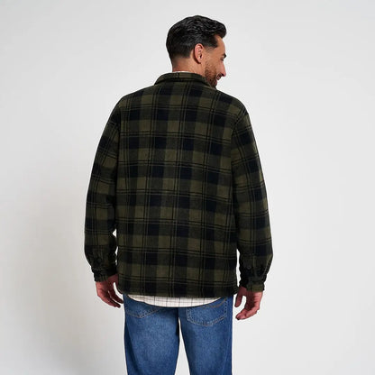 Man in Jack Pyke Tundra Shirt with olive black plaid flannel