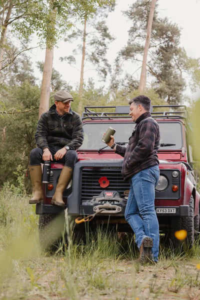 Red off-road vehicle paired with Jack Pyke Tundra Shirt for outdoor adventure vibes