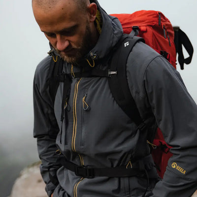 Bearded guy rocking a Keela Hydron Softshell jacket with a cool red backpack
