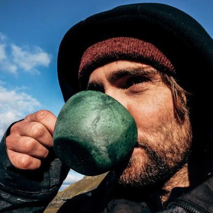 Man enjoying his Kupilka Classic Cup outdoors while wearing country clothing