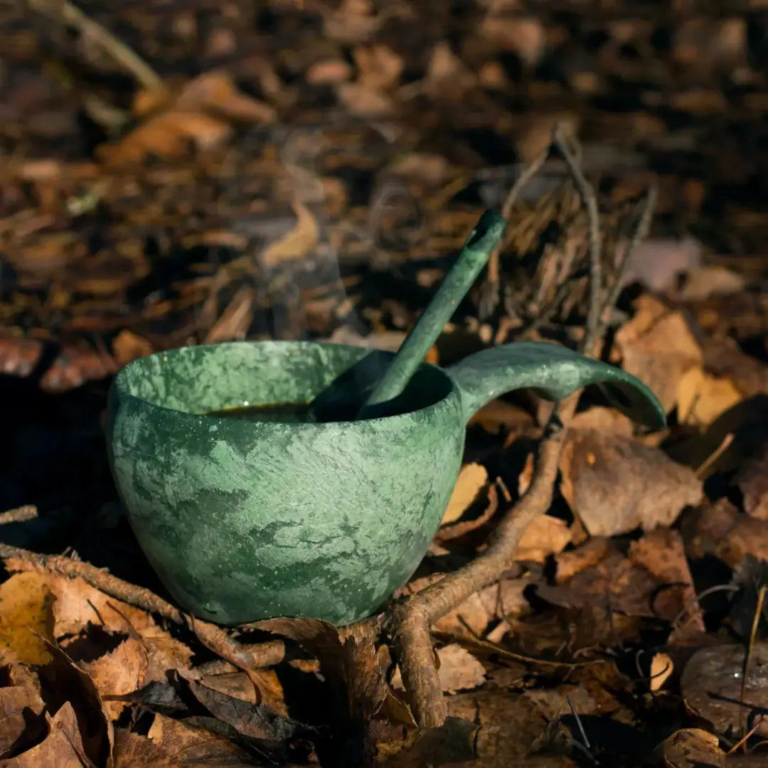 Green wooden Kupilka Classic Cup with spoon, perfect for country clothing and outdoors adventures