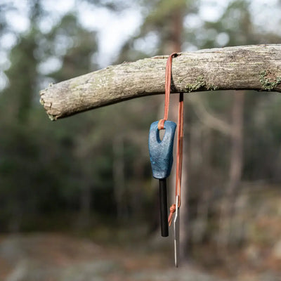 Blue handled Kupilka Firesteel with compact striker, perfect for country clothing adventures