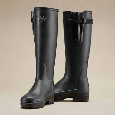 Tall black rubber rain boots with adjustable straps, perfect for Le Chameau Vierzonord neoprene lined style
