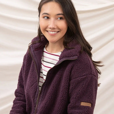 Plum-colored Lighthouse Cobh zip fleece jacket over striped shirt, perfect country clothing
