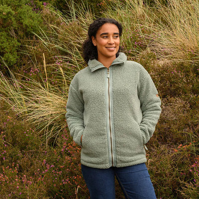 Woman in light green Lighthouse Cobh zip fleece jacket, perfect country clothing style