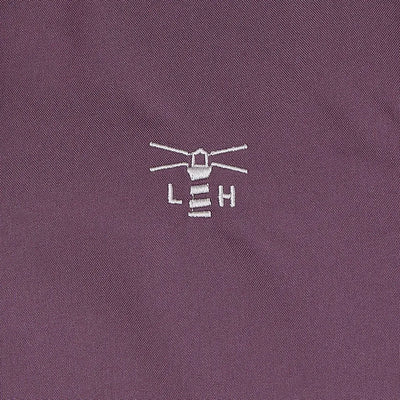 Embroidered lighthouse logo on plum Lighthouse Imogen Ladies Coat fabric for style