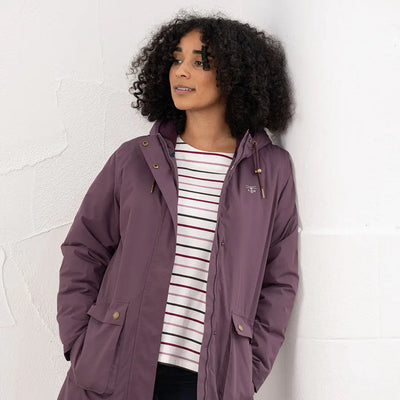 Lighthouse Imogen Ladies Coat in plum with hood, front pockets, over striped shirt