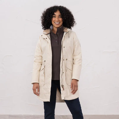 Women wearing lighthouse isobel coat long winter parka with brown fleece top and dark jeans