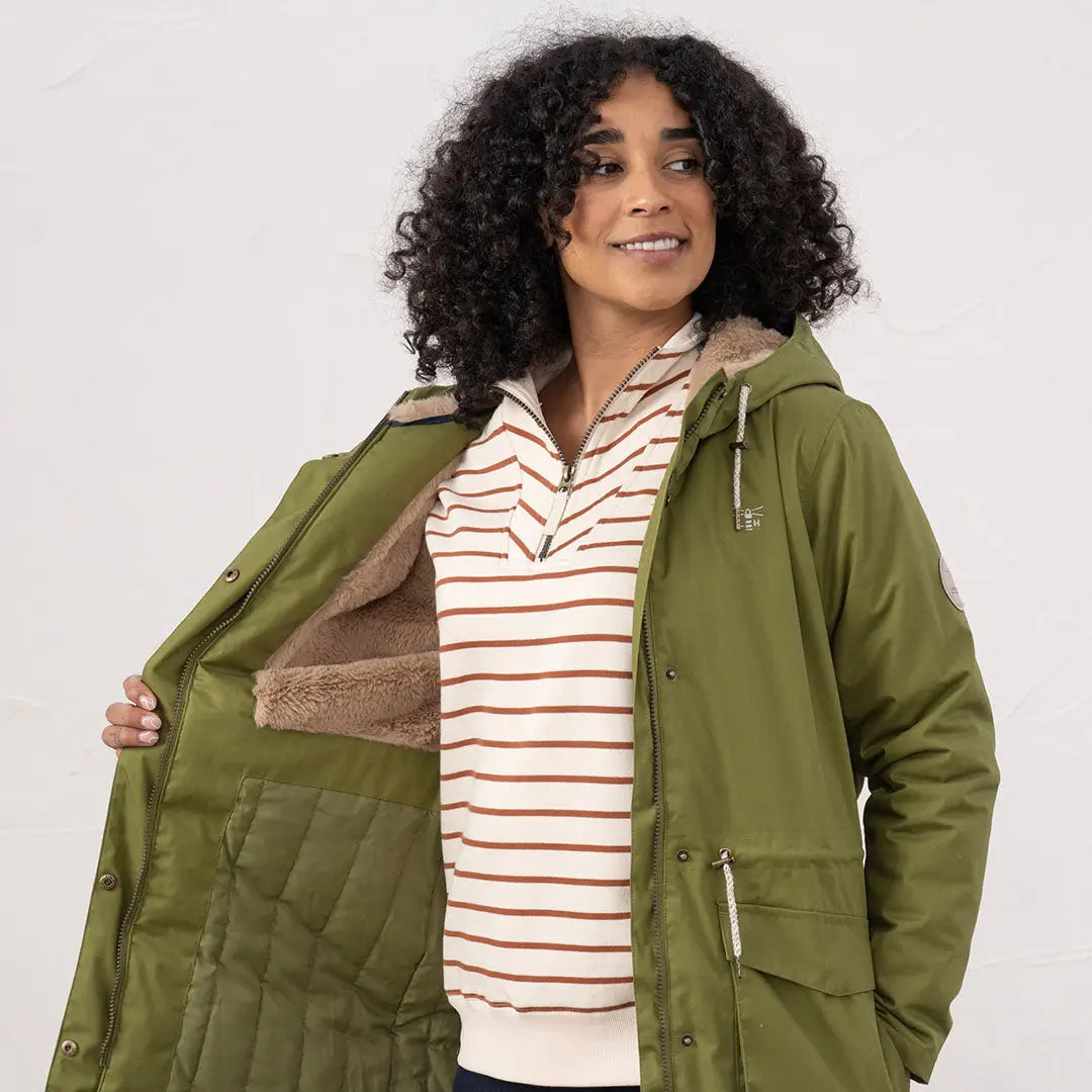 Woman in olive green Lighthouse Isobel Coat with sherpa lining, stylish Isobel coat