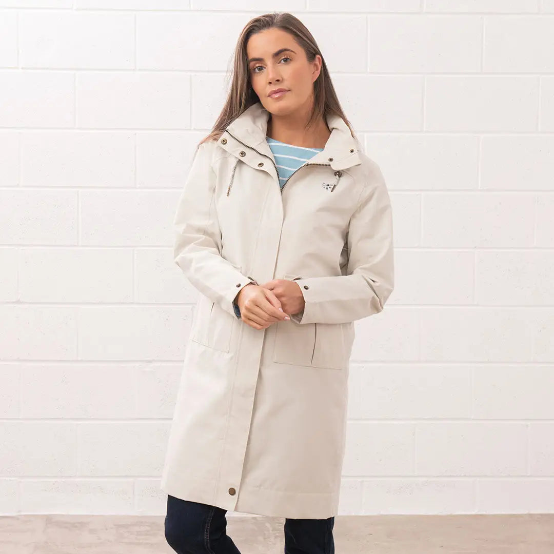 Woman wearing a beige Lighthouse Ladies Annika Coat, stylish ladies annika coat look