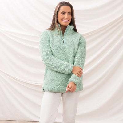 Woman rocking a mint green Lighthouse Ladies Bay Fleece sherpa pullover