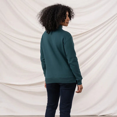 Person wearing Lighthouse Ladies Coral Jersey turtleneck and dark blue jeans