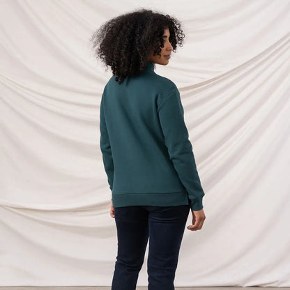 Person wearing Lighthouse Ladies Coral Jersey turtleneck and dark blue jeans