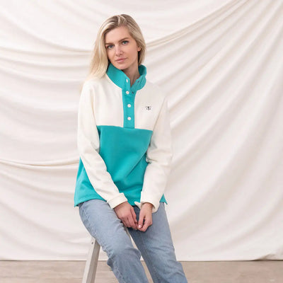 Woman in a colorful Lighthouse Ladies Haven II Jersey fleece pullover showcasing style and comfort