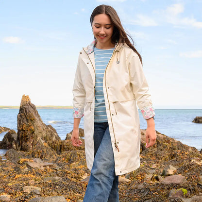 Woman wearing cream-colored Lighthouse Ladies Pippa Coat, stylish ladies pippa coat look