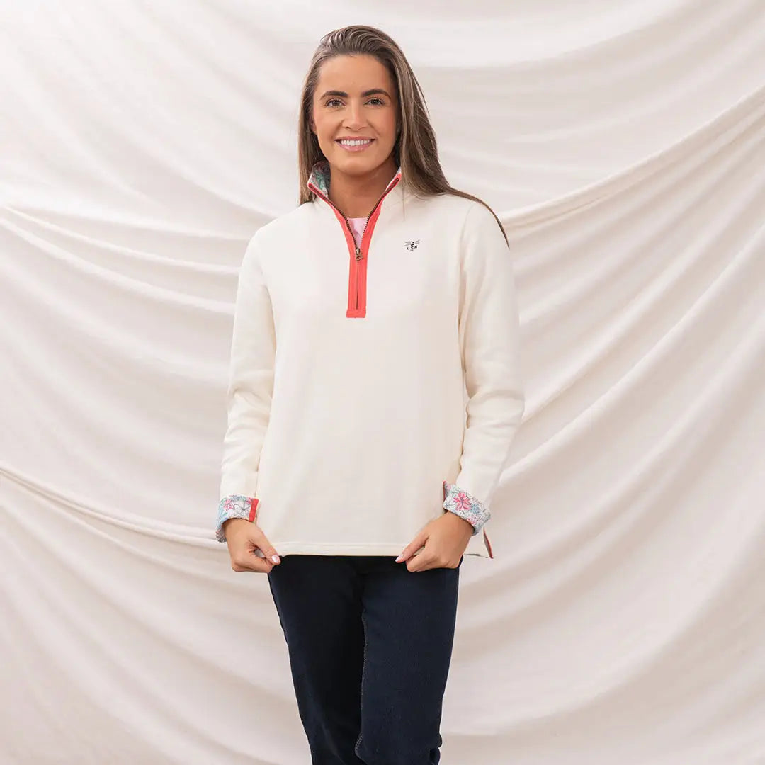 Woman wearing Lighthouse Ladies Shore II Jersey cream pullover for a cozy look