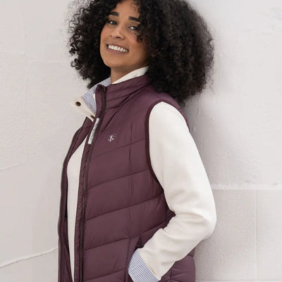 Lighthouse Laurel ladies burgundy puffer vest with striped collar and white shirt