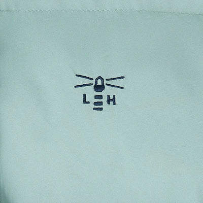 Embroidered lighthouse logo on light blue Lighthouse Margot Ladies Coat fabric