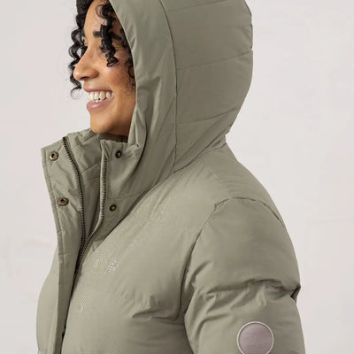 Woman in sage green Lighthouse Savannah Coat with hood, perfect for chilly days