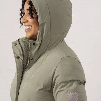 Woman in sage green Lighthouse Savannah Coat with hood, perfect for chilly days