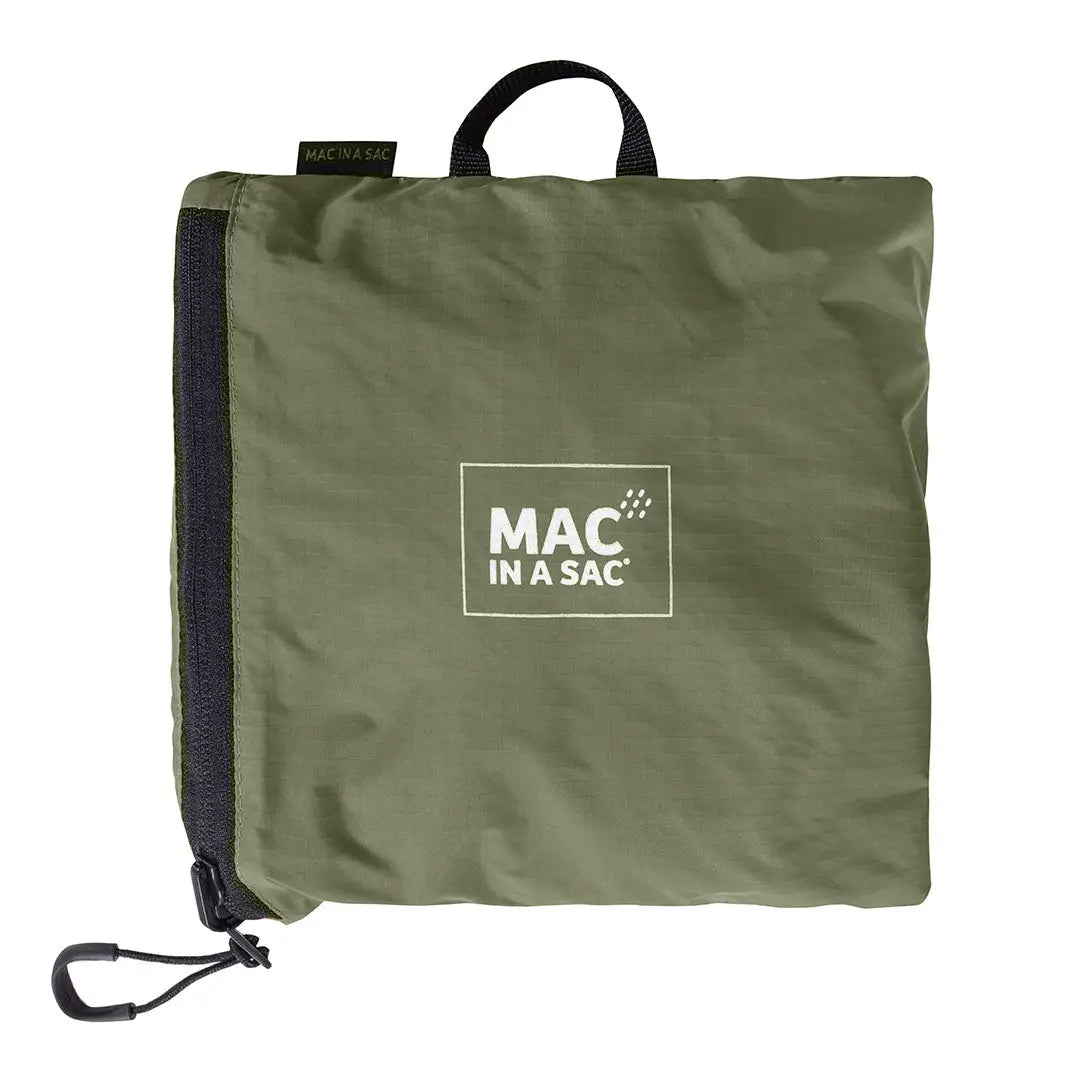 Folded olive green rain jacket in a Mac in a Sac Travelite Backpack ready for adventure