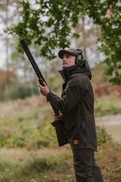 Man in hunting attire with shotgun wearing New Forest Country Sport Smock for forest country sport