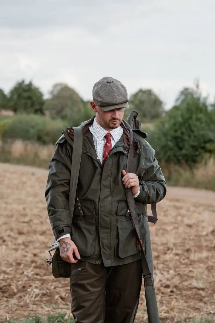 Man in green hunting jacket and tie wearing New Forest Country Sport Trousers