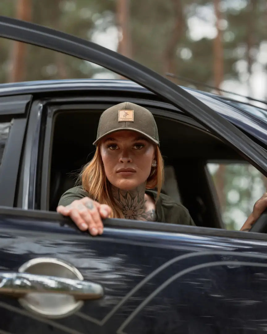Woman wearing a New Forest Country Sport Trucker Hat in a car, iconic trucker hat look