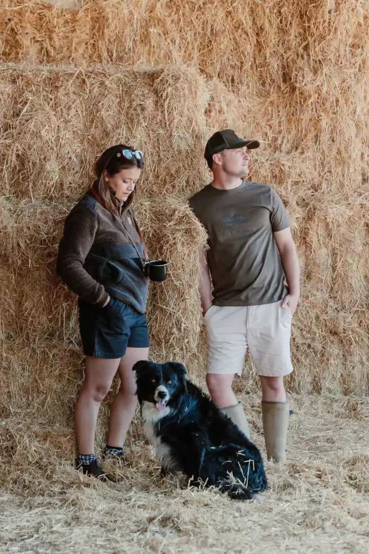 Rural scene with people and dog featuring a New Forest country sport iconic trucker hat