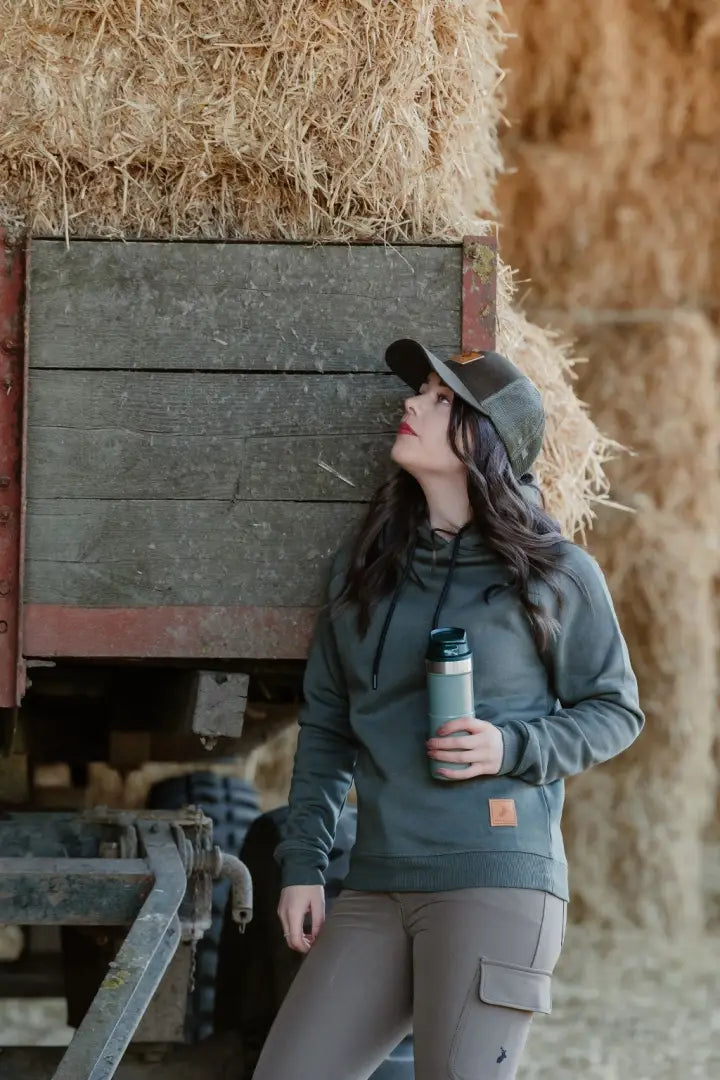 Woman wearing the New Forest Country Sport Trucker Hat, an iconic trucker hat for outdoor adventures