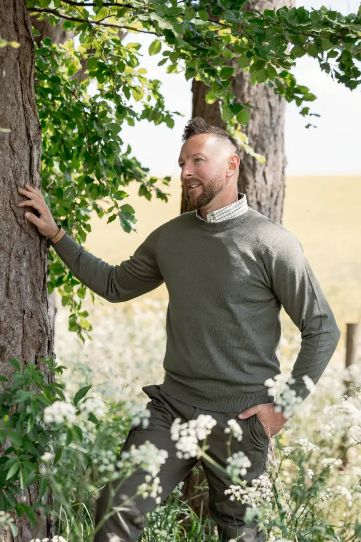 Man wearing New Forest Crew Neck Jumper in green, perfect forest crew neck style