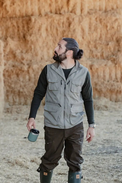 Man in outdoor attire wearing New Forest Explorer Gilet for forest explorer adventures