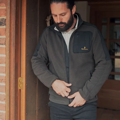 Man zipping up forest fallow fleece jacket from New Forest Fallow collection