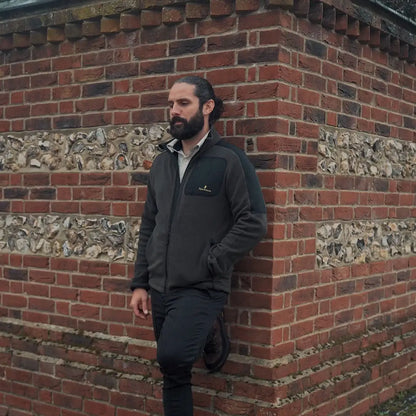 Man in gray jacket wearing the New Forest Fallow Full Zip Fleece, perfect for outdoor cold weather