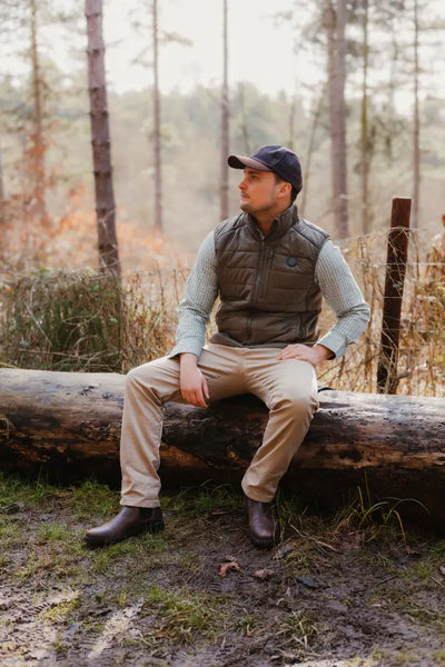 Man in outdoor clothing wearing a New Forest Heated Gilet for cozy adventures