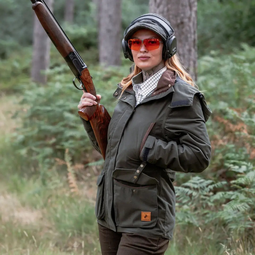 Woman wearing New Forest Ladies Baker Boy Hat while using shotgun and ear protection