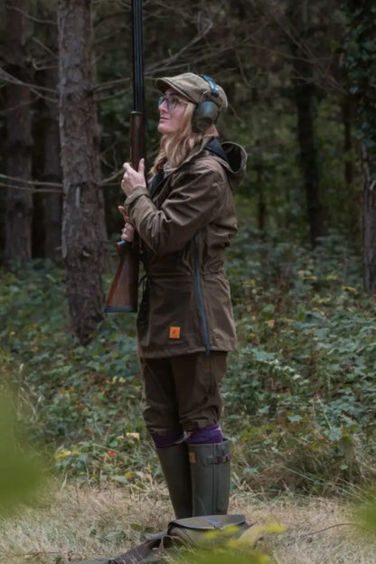 Woman in hunting gear wearing New Forest Ladies Country Sport Smock with shotgun
