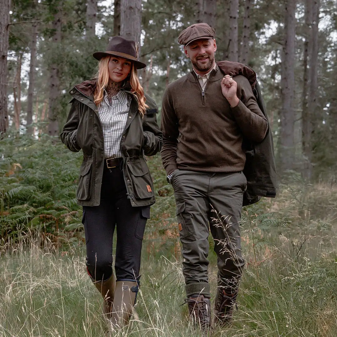 Couple in outdoor gear wearing Forest Ladies Marsh Jacket in nature setting